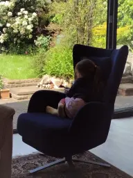 Grandaughter enjoying my comfy, new Kylian armchair