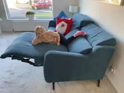 Grand daughter enjoying grans new sofa she got for Christmas